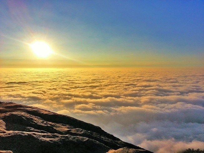 Sea of clouds at Nandi Hills sunrise point